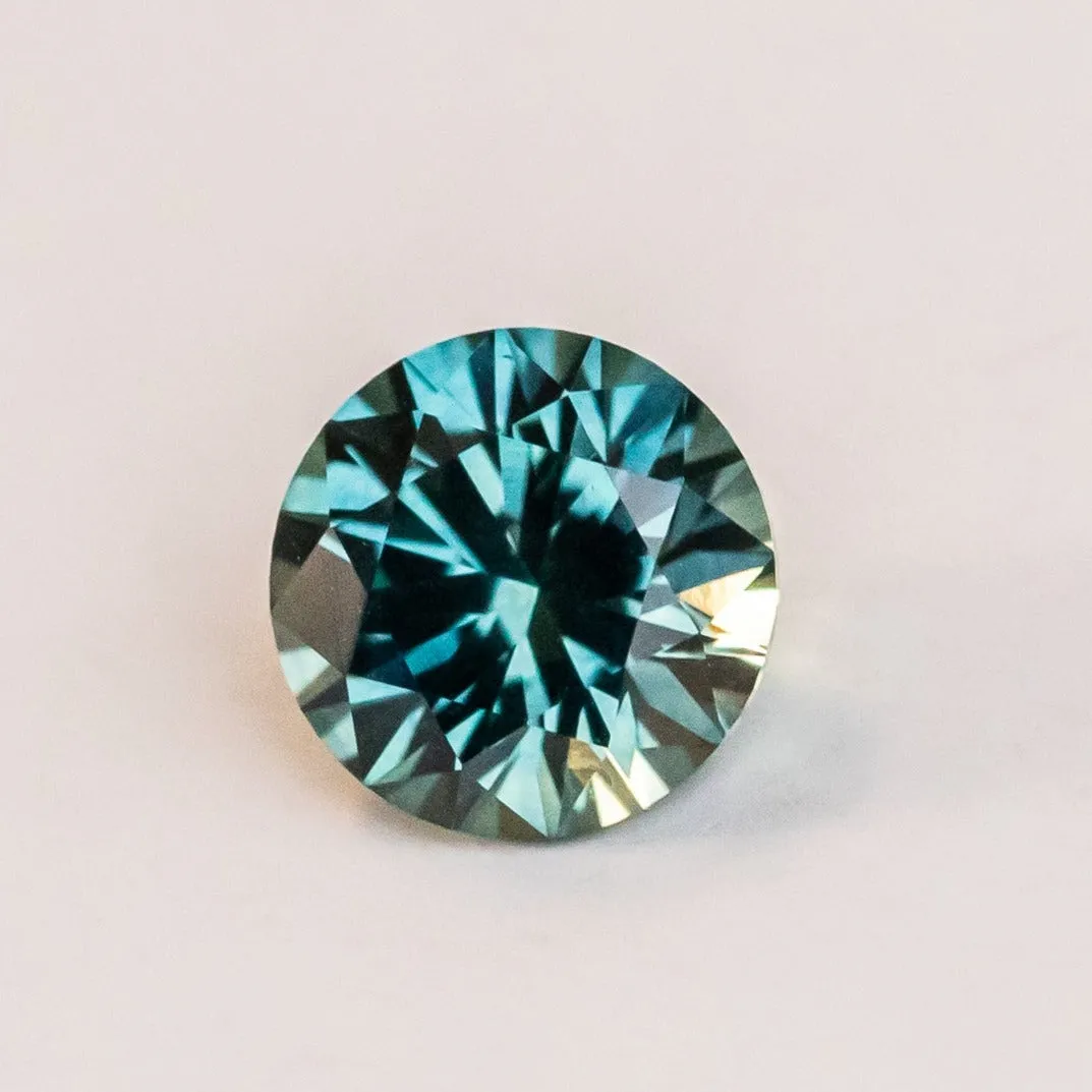 2.35CT ROUND PRECISION CUT MONTANA SAPPHIRE, TEAL BLUE, 7.90X5.22MM