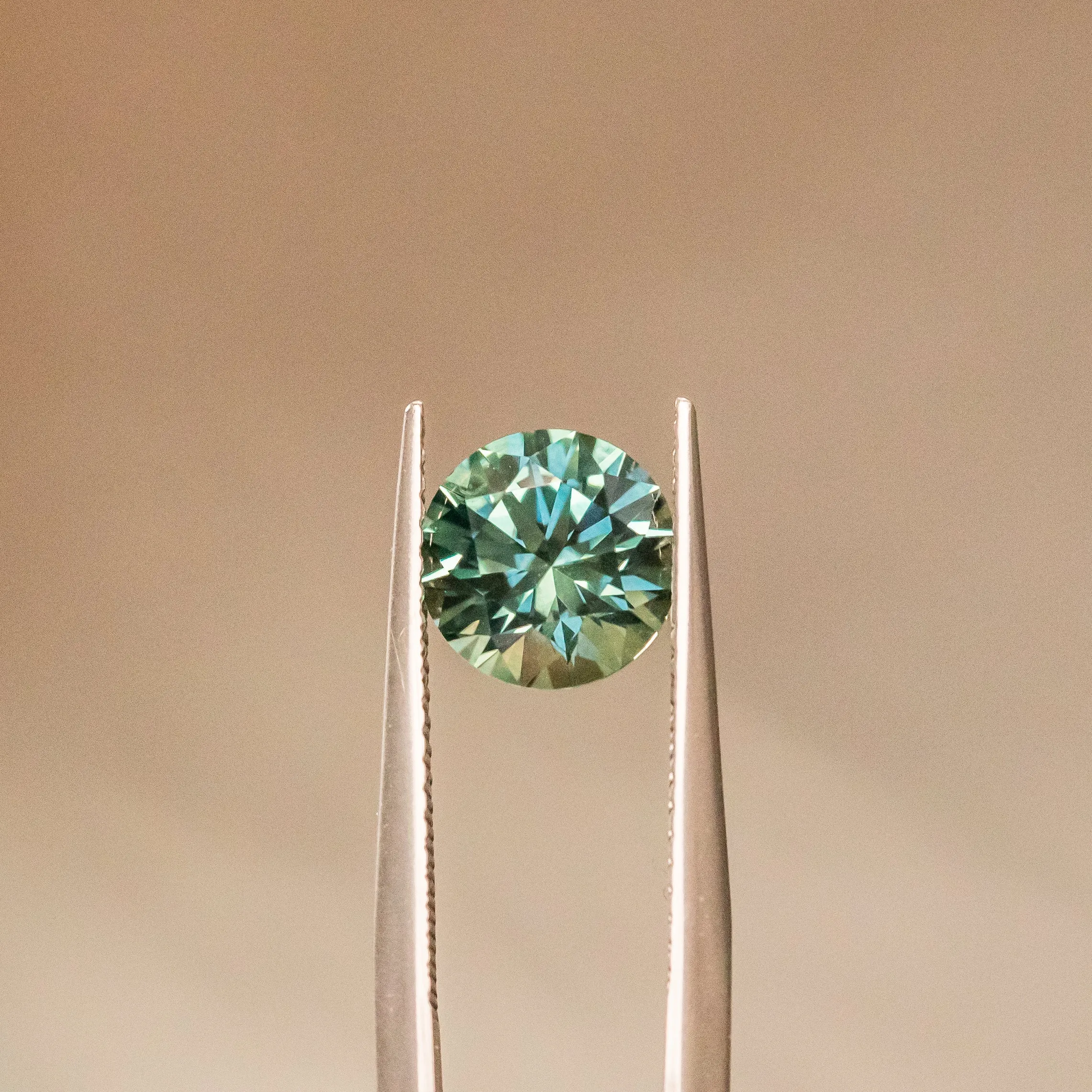 2.35CT ROUND PRECISION CUT MONTANA SAPPHIRE, TEAL BLUE, 7.90X5.22MM