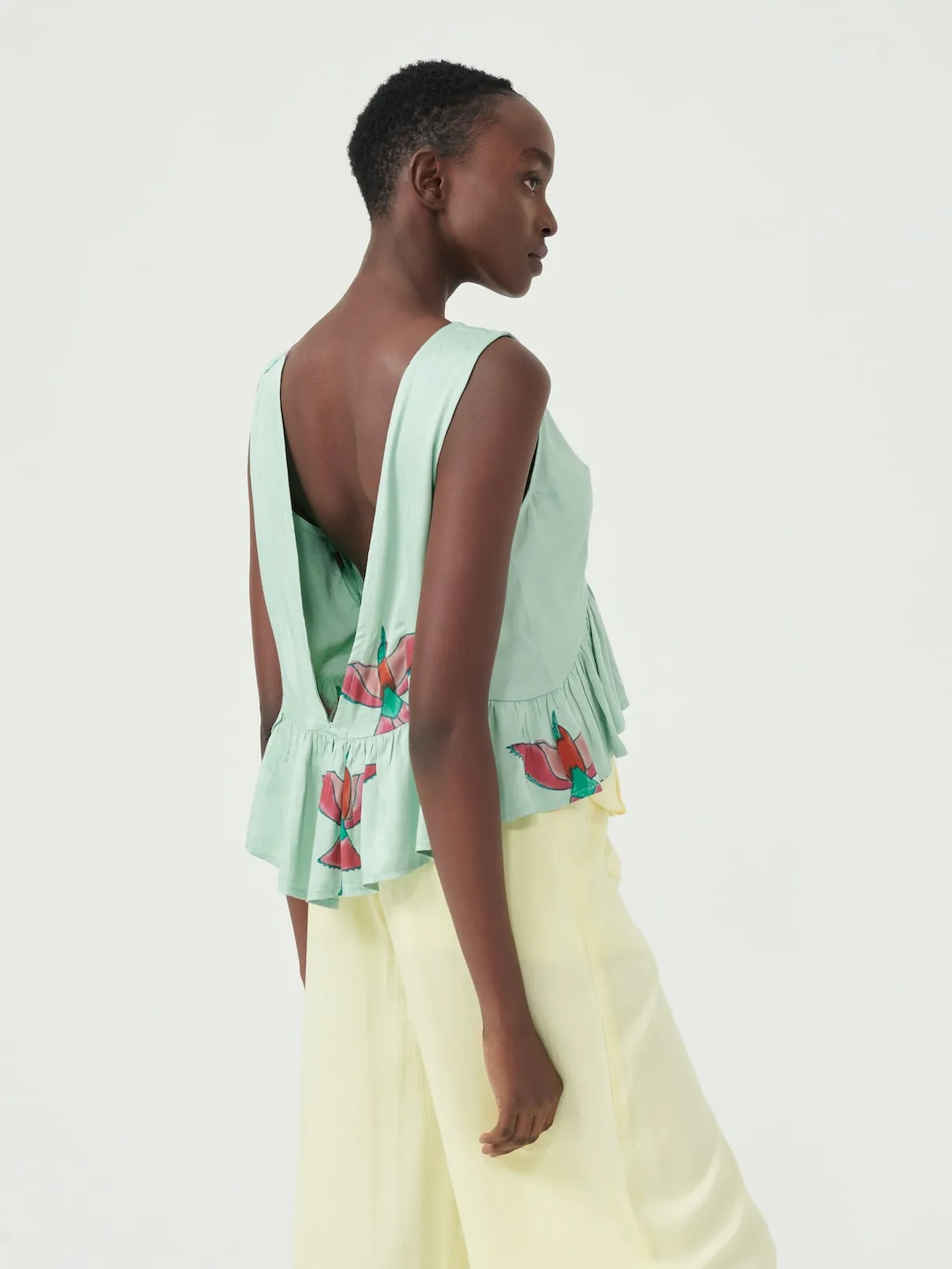 Bee Eater Sleeveless Peplum Top