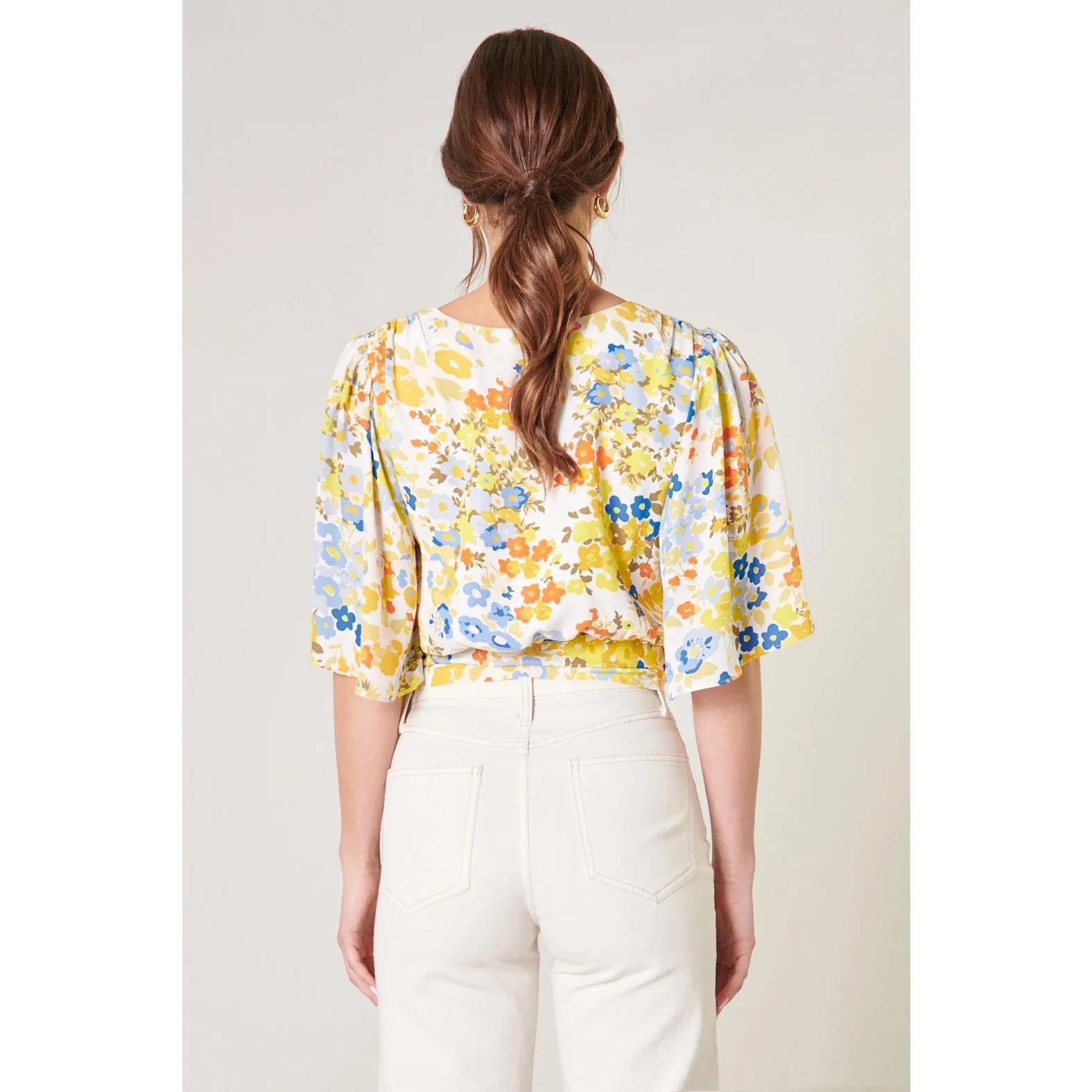 Simmzy Floral Flutter Sleeve Wrap Top